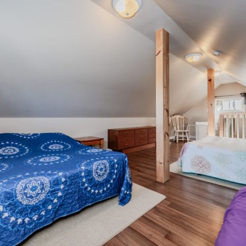 This spacious loft provides ample sleeping arrangements with beds and seating, perfect for larger groups or families.