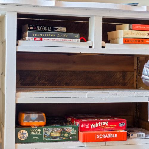 A selection of books and board games is ready for family fun and rainy days.
