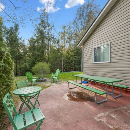 Step outside to a private patio surrounded by nature, perfect for morning coffee or evening relaxation.