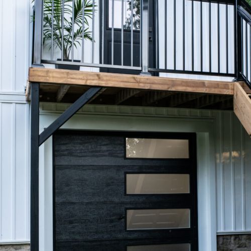 Modern loft entry under the deck with easy access to the lower hangout space.