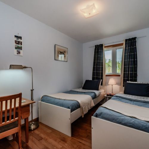 Versatile third bedroom with twin beds, ideal for kids or friends enjoying a beach day at Sauble or hiking along the Bruce Trail.