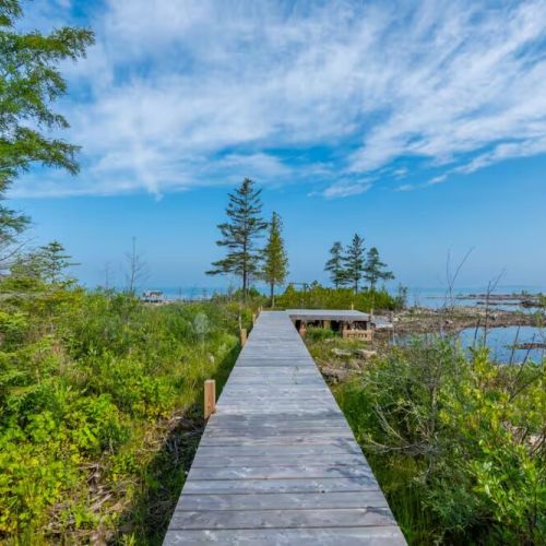 Stroll down your private boardwalk to the water — the perfect start to a morning paddle or an evening lakeside sunset.