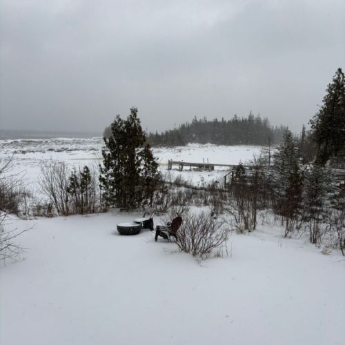 Experience a quiet winter shoreline with snow-covered terrain and expansive lake views. Ideal for travellers seeking tranquility, nature escapes, and scenic four-season waterfront getaways.