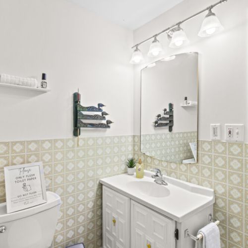 Freshen up in the bright main bathroom with plenty of storage.