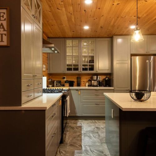 The modern kitchen glows with warmth in the evening—ideal for late-night snacks or a glass of wine.