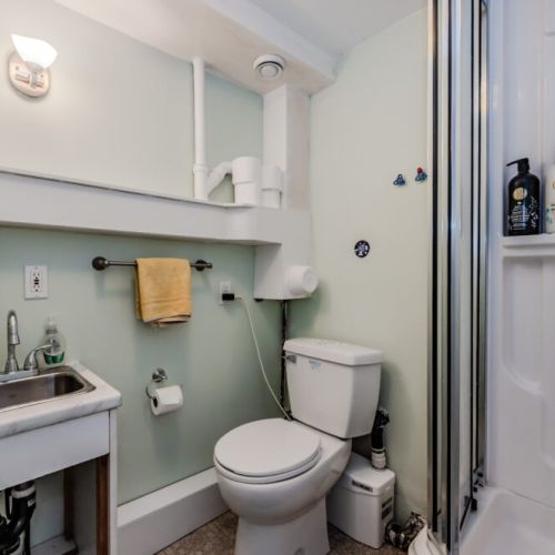 A second full bathroom with shower, ideal for guests needing extra space and convenience during a multi-family or group stay.