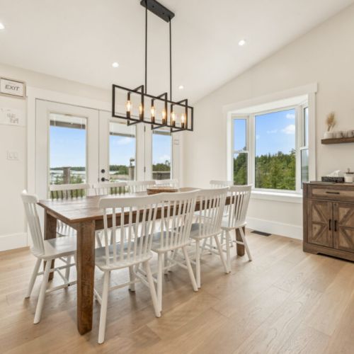 Gather for meals at the large farmhouse table with seating for 10, all while enjoying panoramic views of the surrounding landscape.