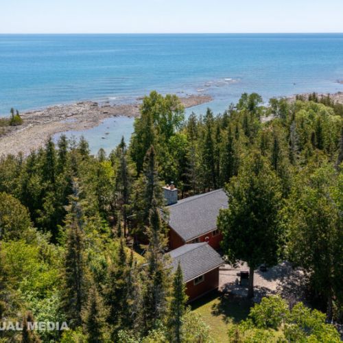 Just steps from Georgian Bay — enjoy total privacy surrounded by cedar forest and turquoise shoreline.