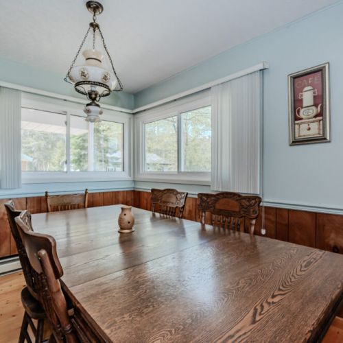 The large dining space has a wonderful and sunny view, perfect for sharing a meal with friends and family.