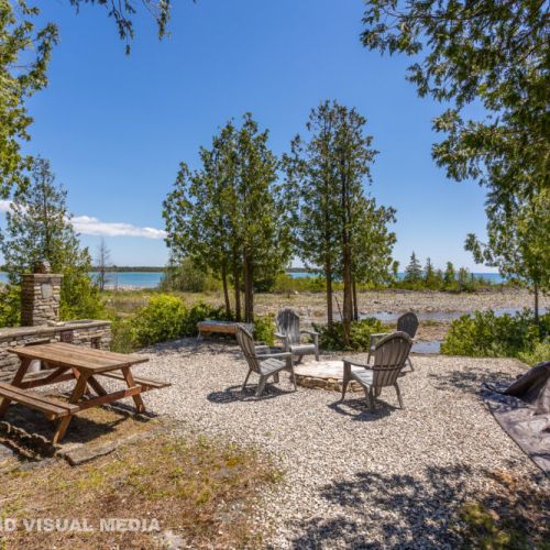 Gather around the firepit or enjoy lunch at the picnic table with stunning views of the rocky shoreline.