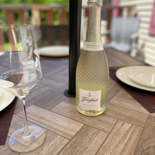 Unwind with a bottle of bubbly on the patio. Perfect for dining al fresco and enjoying peaceful outdoor moments.