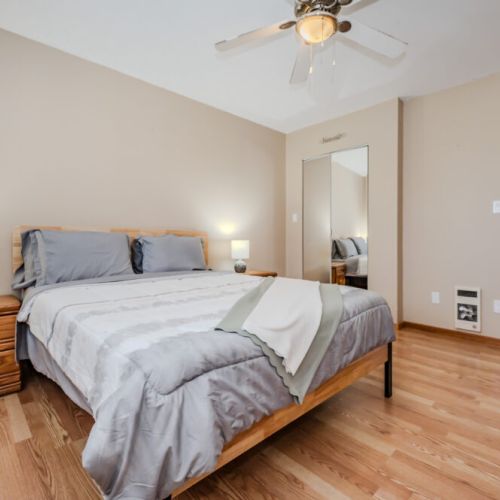 This room offers plenty of natural light, with large windows that create a bright and airy environment. The room is perfect for unwinding in the evening or enjoying a lazy morning.