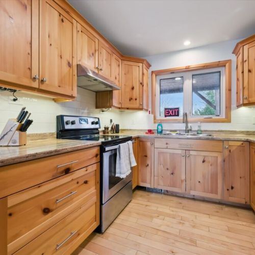 The bright kitchen workspace offers plenty of counter space and everything you need to cook comfortably during your stay.