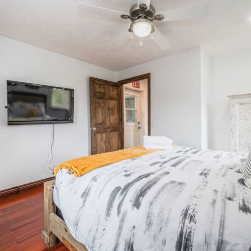 The second guest room has a private ensuite bathroom and smart TV.
