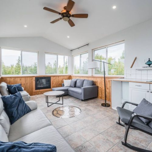 The solarium is the perfect spot to entertain. With a fireplace, private sink, and plenty of lounge space, take in the views while having a drink or two.