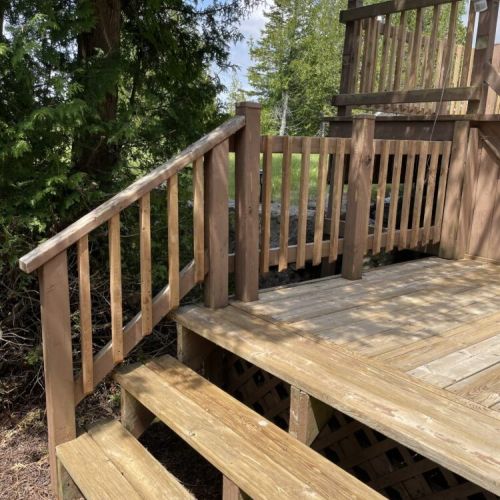Spacious deck access with steps leading into nature
