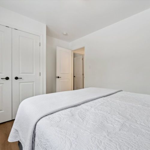 Cozy and comfortable bedroom with clean, modern finishes and plenty of storage for a relaxed cottage stay.