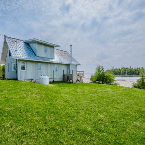 The side yard offers additional outdoor space, perfect for pets and children to play in a secure environment.