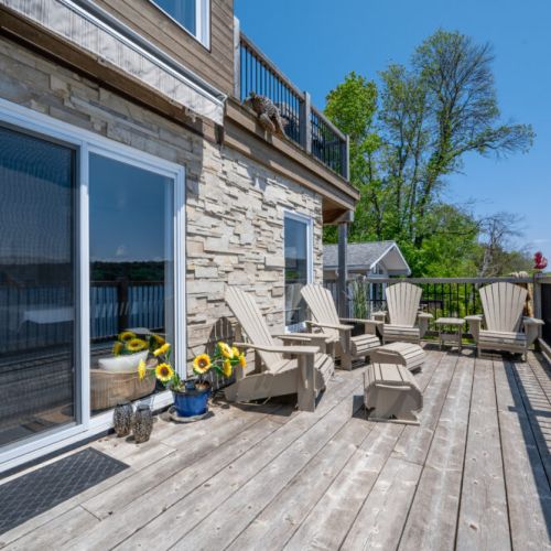 Expansive lower deck with comfortable seating—perfect for relaxing by the water.
