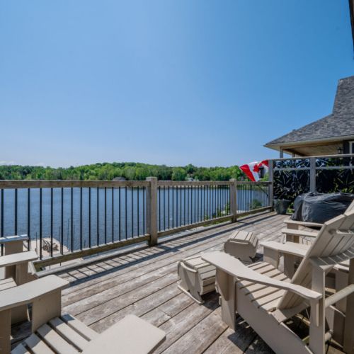 Spacious deck with plenty of seating to soak in the sun and scenery.