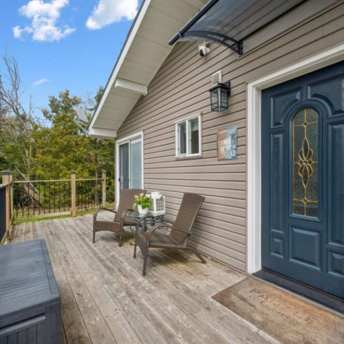 Welcoming front entrance with a peaceful seating area to enjoy your morning coffee.