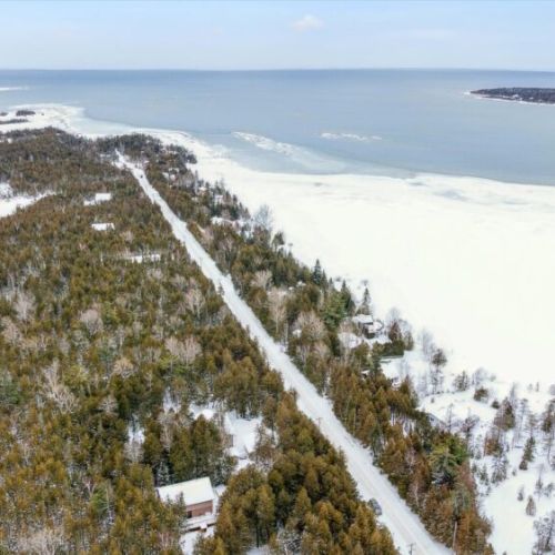 Scenic winter view toward the frozen shoreline and expansive lake horizon