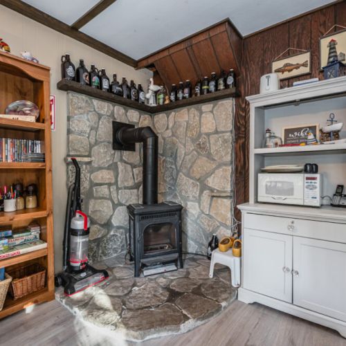 The wood burning fireplace adds more warmth and atmosphere to the Barn.