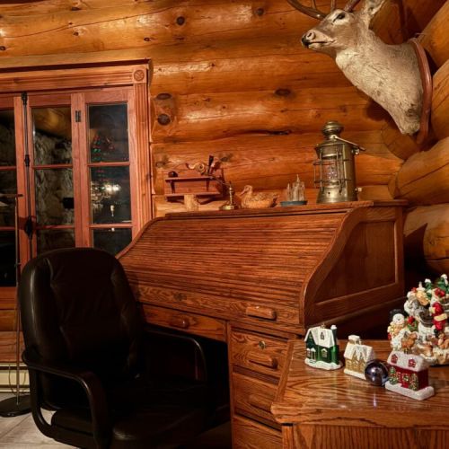 Rustic retreat details, the roll top desk and woodland décor make Timber Shores feel like home for the holidays