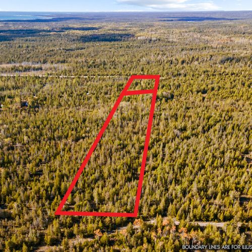 An aerial view highlights the property's nearly 4 private acres tucked away in the heart of the Bruce Peninsula.