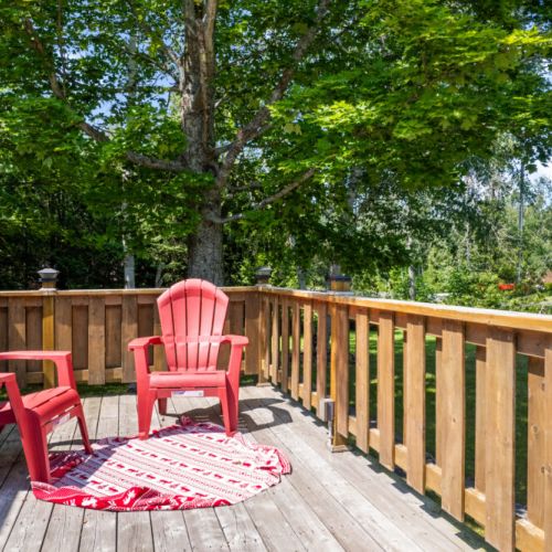 A cozy corner of the deck invites you to relax with your morning coffee.