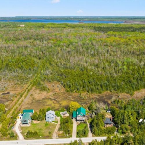Scenic aerial view showcasing the cottage surrounded by beautiful Bruce Peninsula nature.