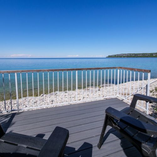 Enjoy morning coffee or evening sunsets from your private shoreline viewing deck.
