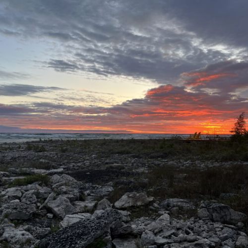 End your day with a breathtaking show—fiery skies meet rugged shoreline for unforgettable sunset views right at your doorstep.