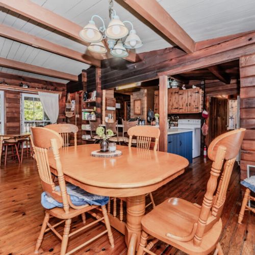 Experience rustic comfort at this log cabin vacation rental featuring a fully equipped kitchen, spacious dining area, and warm wood interiors—ideal for relaxing family holidays, group getaways, or peaceful nature escapes.
