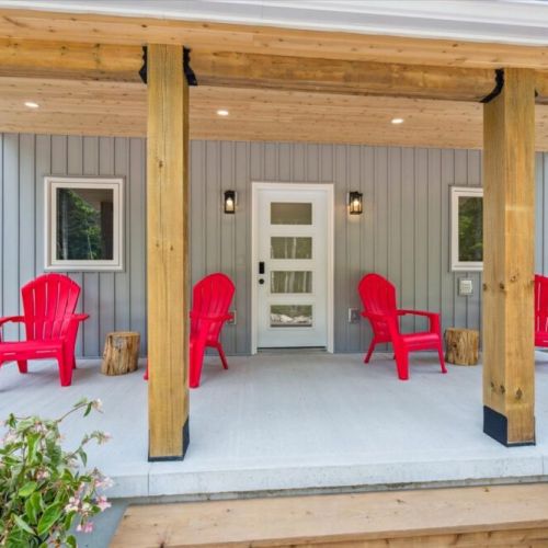 Relax with your morning coffee or evening glass of wine on the bright red Muskoka chairs overlooking the forest.