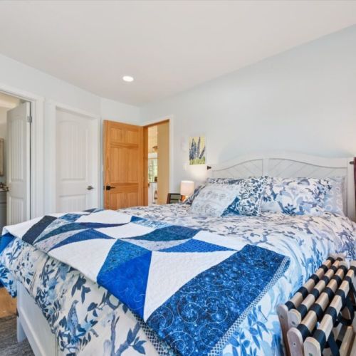 Drift off to sleep in this cozy bedroom, thoughtfully furnished to provide a relaxing retreat after a day of exploring.