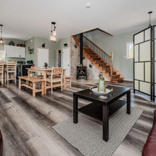 Enjoy the full cottage experience with connected kitchen, dining, and lounging areas—ideal for families or groups staying in Bruce Peninsula.