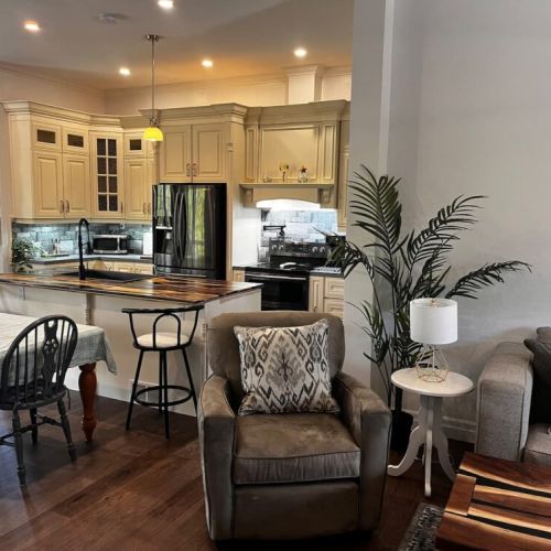 Open-concept living space connecting the living room and kitchen for easy group time