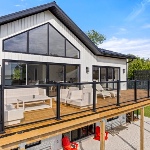 Step outside onto the expansive deck overlooking the beautiful waterfront.