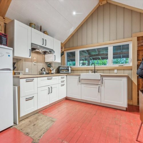 Cook up something special in the fully equipped kitchen, complete with butcher block countertops, full-size fridge, farmhouse sink, and all the cookware you’ll need for a cottage feast.