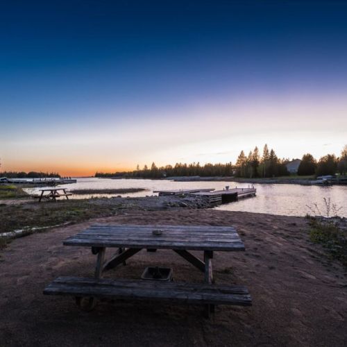 Relax by the beach area and dock while soaking in the stunning sunset skies.