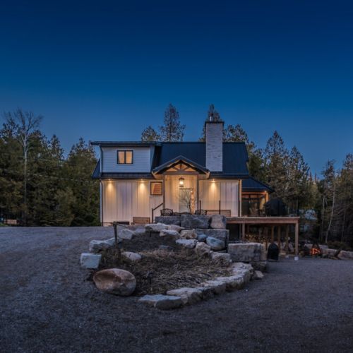 Enchanting evening escape—this cozy cottage offers peaceful forest surroundings, ambient lighting, and the perfect lakeside setting for romantic nights and relaxing vacations.