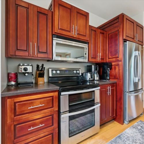 Fully equipped kitchen with modern appliances and ample prep space for group meals.