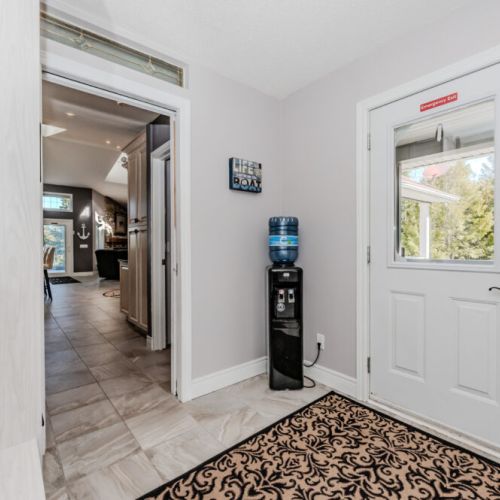 Welcoming entryway with convenient amenities and easy outdoor access—ideal for quick transitions from forest hikes to cozy indoor relaxation during your cottage getaway.