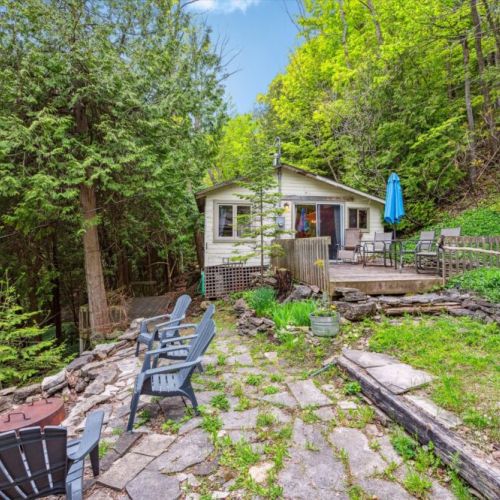 Discover the second rustic cabin with its own character and covered porch. A peaceful hideaway for reading, afternoon naps, or watching wildlife roam.