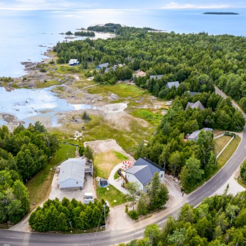 An aerial view showcases Fathom Hideaway's beautiful waterfront location on Hay Bay.