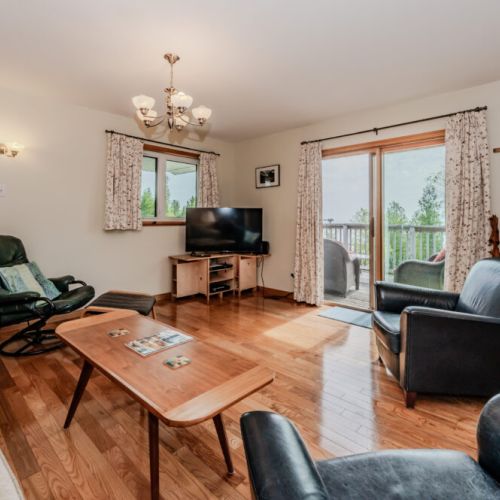 Open-concept family and dining space perfect for shared meals, games, and making memories with loved ones during your Bruce Peninsula stay.