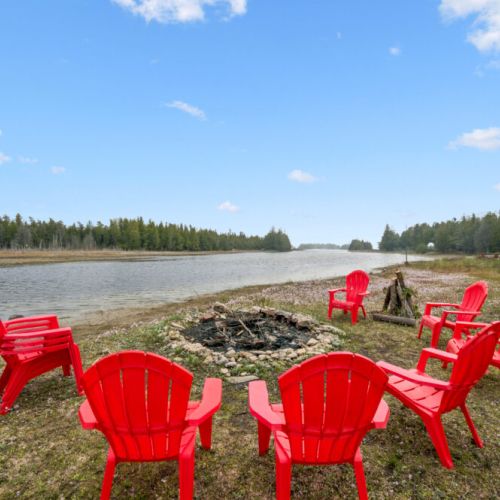 End your evenings around the firepit with Adirondack chairs, lake views, and unforgettable sunsets.