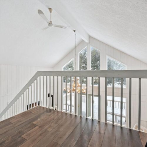 Open loft railing overlooking the great room, adding light and architectural character