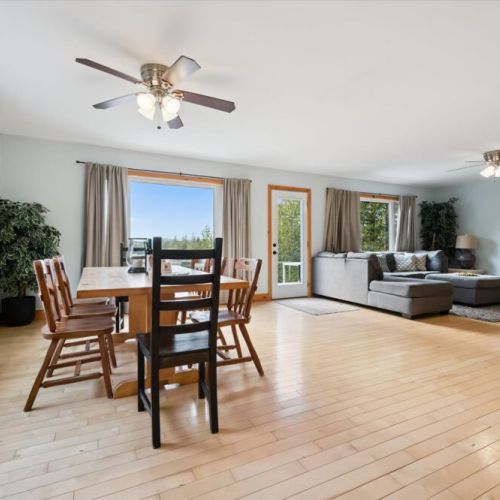 Gather around the dining table with beautiful lake views and direct access to the deck just steps away.